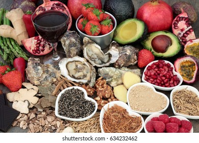 Aphrodisiac love food and drink selection for good sexual health over marble background.