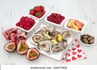 Aphrodisiac love food selection for good sexual health over distressed white wood background.