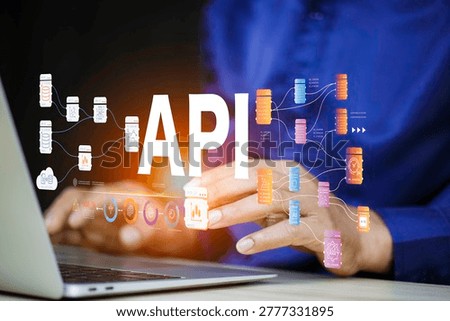 API - Application Programming Interface, Man using laptop computer with API icon on office desk, Software development tool, modern technology, internet and networking.