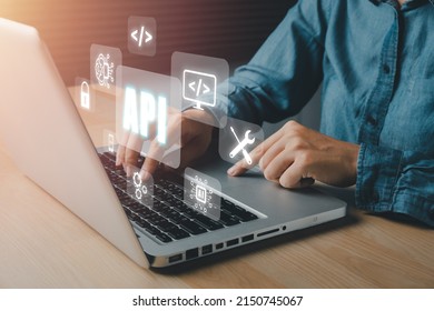 API - Application Programming Interface, Woman using laptop computer with VR screen API icon on office desk, Software development tool, modern technology, internet and networking concept.	 - Shutterstock ID 2150745067