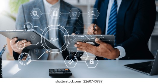 API Application Programming Interface, woman using laptop, tablet and smartphone with virtual screen API icon Software development tool, modern technology and networking concept. - Shutterstock ID 2260740989
