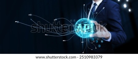 API: Businessman Touching Digital Global Network of API Data Exchange. Seamless Integration on Social Network Connection with Hologram Modern Interface, Advanced Functionality