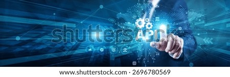 API Developer touch with global on structure API interface, enabling integration, connectivity, data exchange, automation, flexibility, services, and digital transformation.