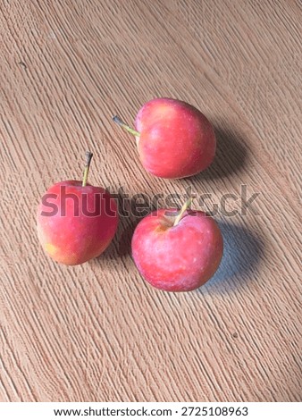 the aplle Cherry in the brown floor