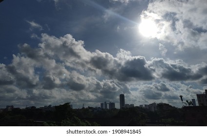 Apocalyptic Sillhouette Of City Skyline Against Bright Sun