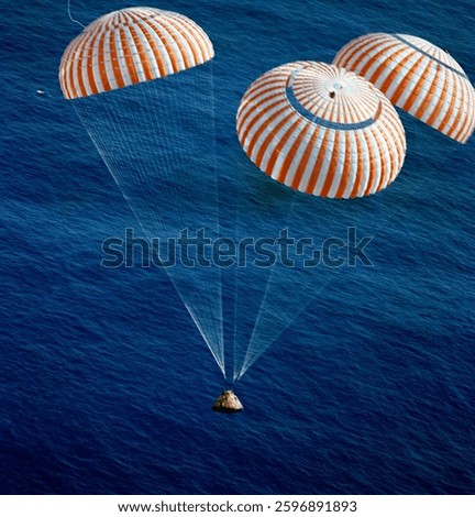 The Apollo 17 Command Module (CM), with astronauts Eugene A. Cernan, Ronald E. Evans and Harrison H. Schmitt aboard, nears splashdown in the South Pacific Ocean. 