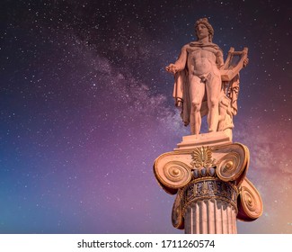 Apollo The Ancient Greek God Of Poetry And Music Under Starry Night Sky, Athens Greece