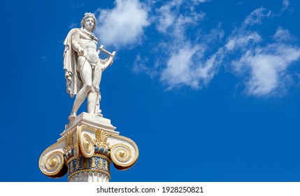 Apollo (or Apollonas), The Ancient Greek God Of Light And Music. His Statue Is In Front Of The Academy Of Athens, Greece, Europe.