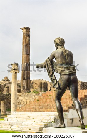 Apollo statue in the ruins of Pompeii (apollo temple), Italy. The Temple of Apollo was built in the third centruy B.C. and ruined during Vesuvius eruption in 79AD