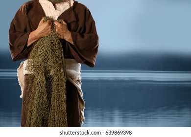 Apostle and fisherman holding nets with lake in background