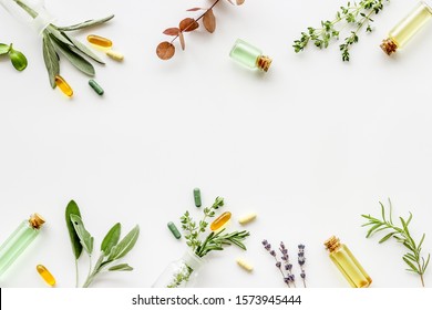 Apothecary Of Natural Wellness And Self-care. Herbs And Medicine On White Background Top View Frame Copy Space