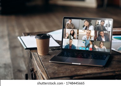 App for remote communication. Virtual meeting online. Video conference by laptop. Online business meeting. On the laptop screen, people who gathered in a video conference to work on-line - Shutterstock ID 1748445665