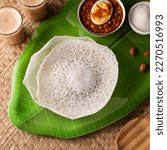 Appam pancake Kerala breakfast food Kadala curry egg curry chickpea Masala and tea. Christian breakfast on wooden background. Fermented rice pan cake. Top view of Indian veg food.