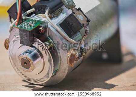 An appearance of the Old Brushed DC Motor. The rear part is equipped with Incremental Rotary Encoder and Optical Encoder Reading Circuit as well.