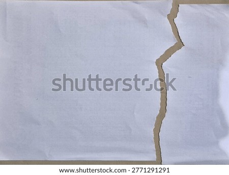 The appearance of the paper is torn and split at the ends.