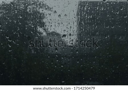 Similar – Rainy day I View through a wet window pane onto a busy street