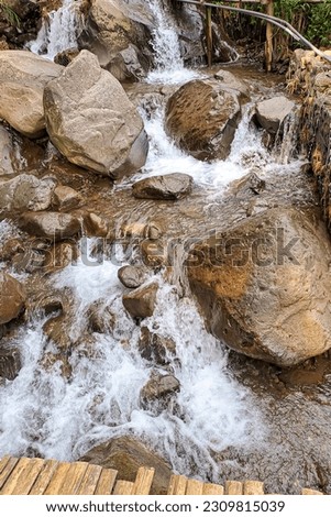 Appearance of river water flow on rocks, which are in the natural tourism area of ​​Kali Kesek, Limbangan, Kendal, Central Java.