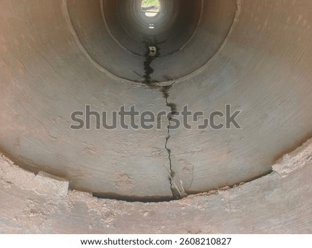 It appears that the pipe culvert that has been installed has cracks from the inside. Image from the outside view into the culvert.