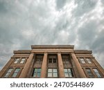 Appellate Courthouse of the State of Illinois Fourth District Front Facade in Springfield, Illinois, USA. Cloudy overcast skies overhead. Partial front view. 