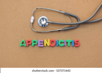 Appendicitis colorful word on the brown background with stethoscope