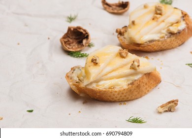 Appetizer Bruschetta With Apple, Walnut And Honey On Top