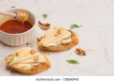 Appetizer Bruschetta With Apple, Walnut And Honey On Top