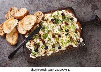 Appetizer Butter board, flavorful, food trend, spread, snack served with bread closeup on dark background. Horizontal top view from above - Shutterstock ID 2232029541