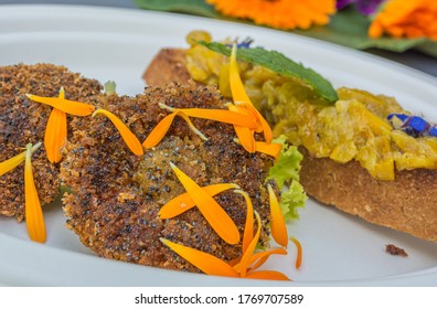 Appetizer Of Calendula Flowers And Crouton. Plate Decorated With Fresh Flowers. Flower Food Concept. Edible Summer Flowers