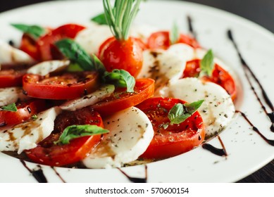 Appetizer With Feta And Tomatoes On Dish