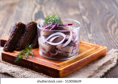 Appetizer Food, Herring In A Glass And Rye Bread On Wooden Board