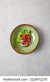Appetizer - roast beef with sauce, cucumber and onion in ceramic bowl. Roast beef in modern ceramic dishware. Handmade dinner plate. Modern food in handmade dishware - Shutterstock ID 2126972270