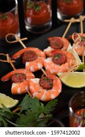 Appetizer Of Shish Kebab With Shrimps And Chorizo Sausages With Barbecue Sauce In A Glass