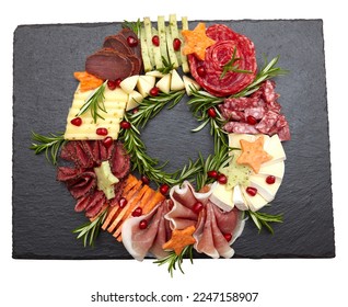 Appetizers boards with assorted cheese, meat, grape and nuts. Charcuterie and cheese platter. Top view on white background. Christmas wreath - Powered by Shutterstock