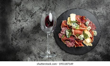 Appetizers. Differents Antipasti, Charcuterie, Snacks And Wine. Sausage Ham, Tapas, Jamon, Cheese For Buffet Party Flat Lay