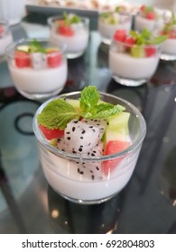 appetizers Healthy. Fruit salad yogurt in the glass bowl. Dessert of Fruit salad, shallow focus.