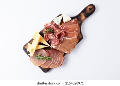 Appetizers table with different antipasti, charcuterie, snacks and cheese. Buffet party. Wooden cutting board isolated on white background, top view
 - Shutterstock ID 2154328971