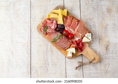 Appetizers table with different antipasti, charcuterie, snacks and cheese. Buffet party. Top view, copy space, negative space - Powered by Shutterstock