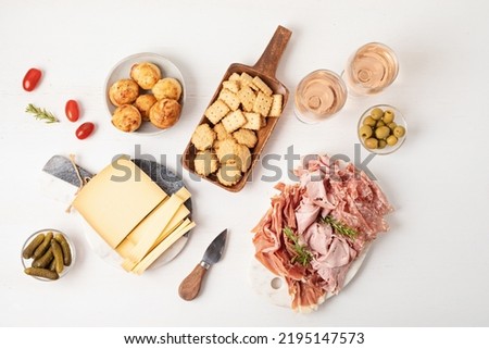Appetizers table with different antipasti, charcuterie, snacks, cheese. Finger food for buffet party. Traditional french or italian entires. Top view