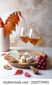 Appetizers Table With Wine Glasses. Fall Fruit Cheese Board. Tasty Cheese Starter With Grapes And Crackers.