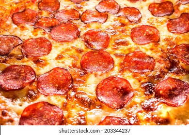 Appetizing Background Pepperoni Pizza Closeup Filling The Frame.