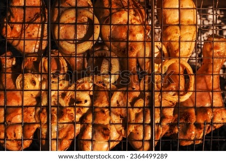 Appetizing chicken legs on the grill.B-B-Q. Stock fotó © 