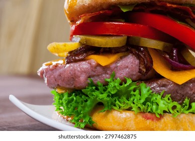 Appetizing double cheeseburger with two grilled beef patties and bacon..