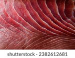 Appetizing fresh sliced bluefin tuna raw meat texture. Close-up. Macro photo. Fish fillet texture as wallpaper