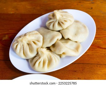 Appetizing Georgian national dish Khinkali, made from wheat flour and minced meat - Shutterstock ID 2253225785