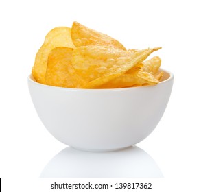 Appetizing, golden chips in the faience bowl, isolated on white