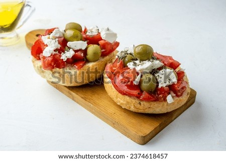 Appetizing Greek dish Dakos, bread with tomatoes and feta cheese