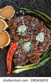 Appetizing medium roast meat steak with red pepper and sauce 