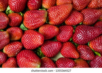 Appetizing ripe strawberries of large size. The view from the top. Background, texture.