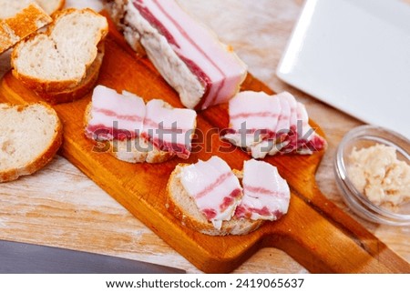 Appetizing sandwiches with salted bacon and homemade horseradish, popular Russian dish