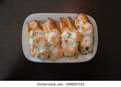 Appetizing Shrimp Bruschetta With Mayonnaise Sauce And Sprinkle Of Onions And Peppers 